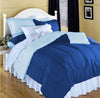Bed made with blue full size reversible comforter