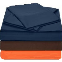 T130 Flat Sheets in multiple colors folded and stacked.