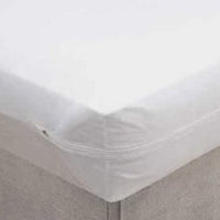 Corner of a bed with a Vinyl Zippered Mattress cover on it.