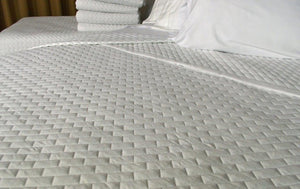 Bed made with Metro Coverlet