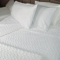 Bed made with Quilted Impressions Double Diamond Coverlet